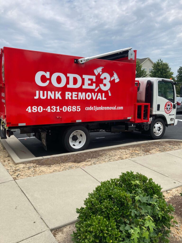 Red STB body on a CODE 3 Junk Removal customer truck